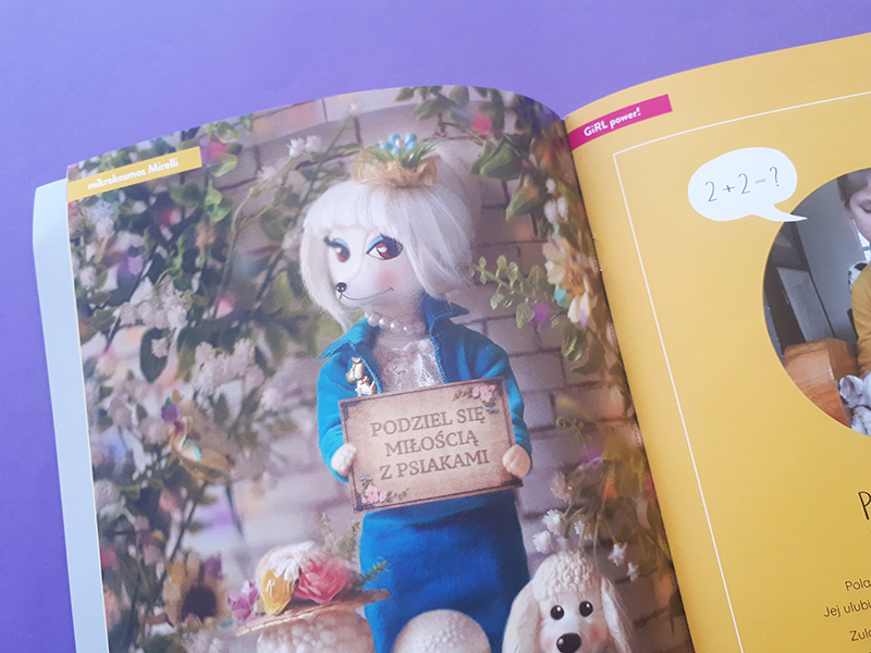 Strona magazynu ze zdjęciem psiej damy. Zabawkowy piesek jest elegancko ubrany i ma na szyi perły. Trzyma tabliczkę "podziel się miłością z psiakami".
